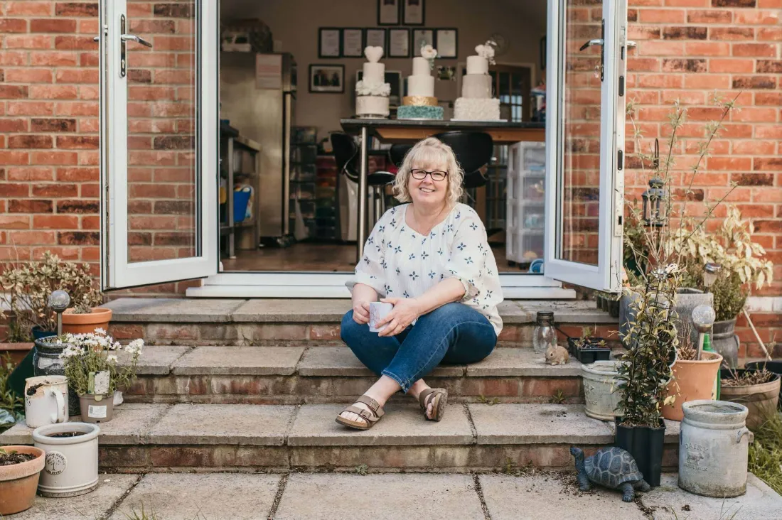 carol smith sitting on a doorstep