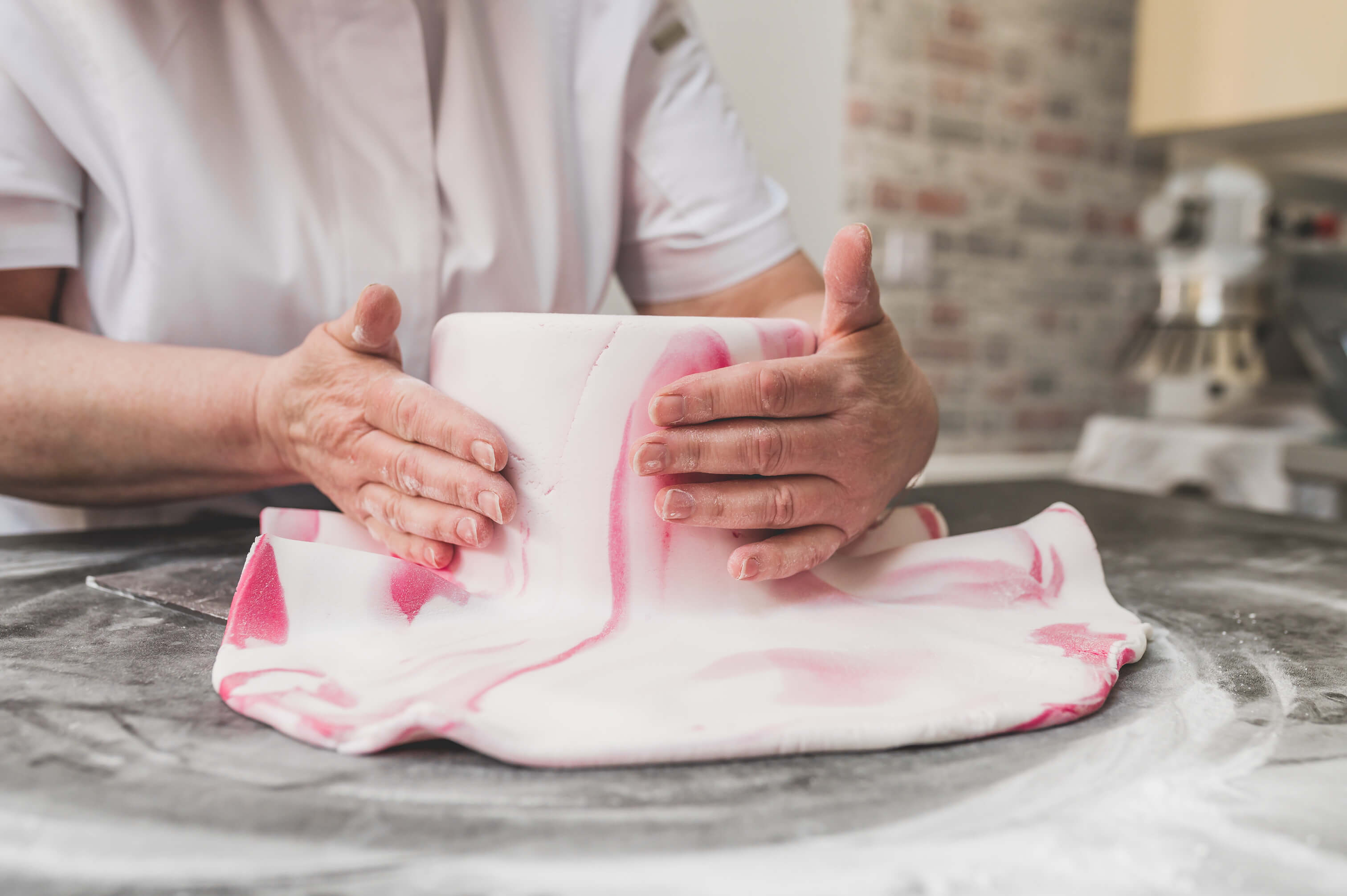 covering cake with fondant